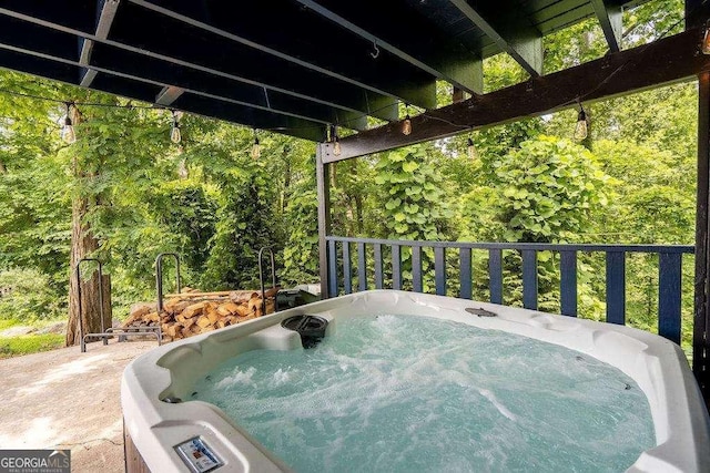 view of patio / terrace with a hot tub