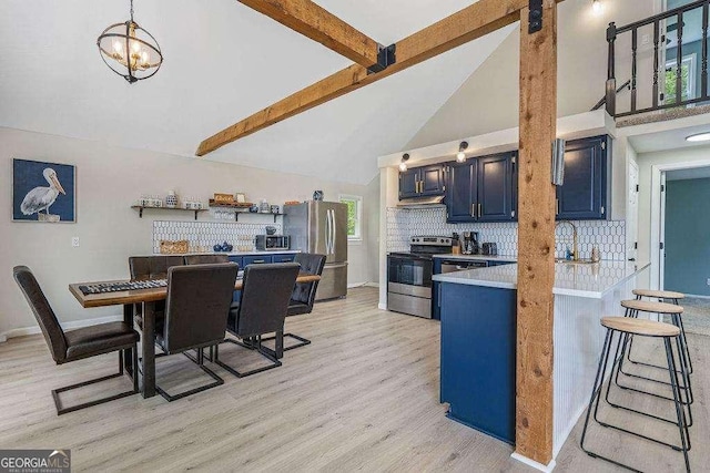 kitchen with blue cabinetry, stainless steel appliances, decorative backsplash, beamed ceiling, and light wood-type flooring