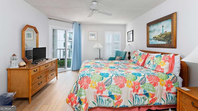 bedroom featuring a textured ceiling, ceiling fan, access to outside, and light wood-type flooring