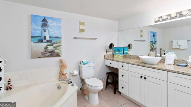 bathroom with toilet, tile patterned flooring, a tub to relax in, and vanity