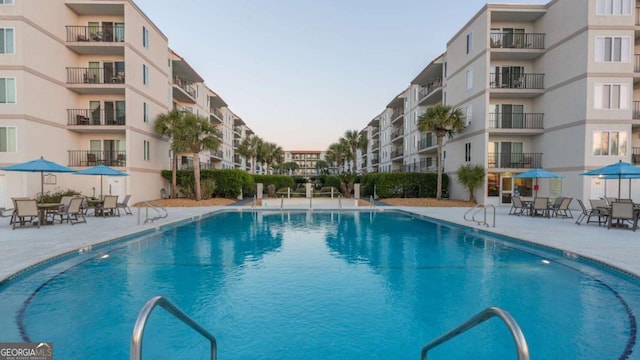 view of swimming pool featuring a patio