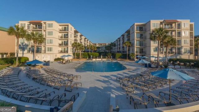 view of swimming pool featuring a patio area