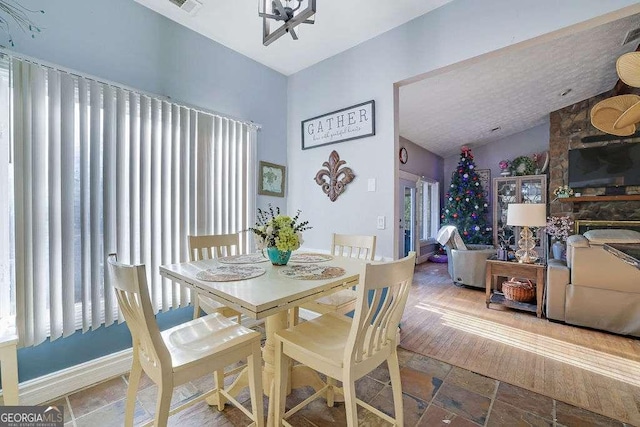 dining room with lofted ceiling