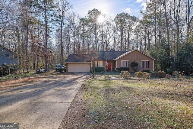 ranch-style house featuring a garage