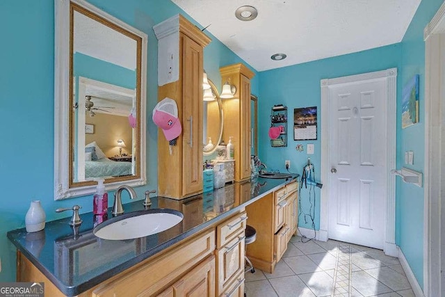 bathroom featuring ceiling fan, tile patterned flooring, and vanity