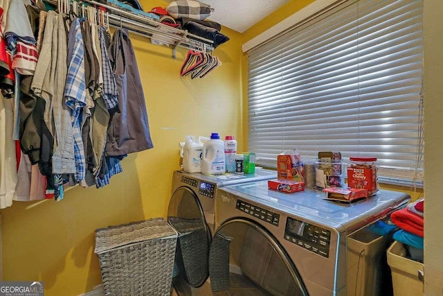 washroom featuring washer and clothes dryer