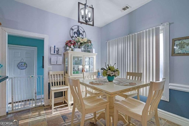 dining area featuring a chandelier