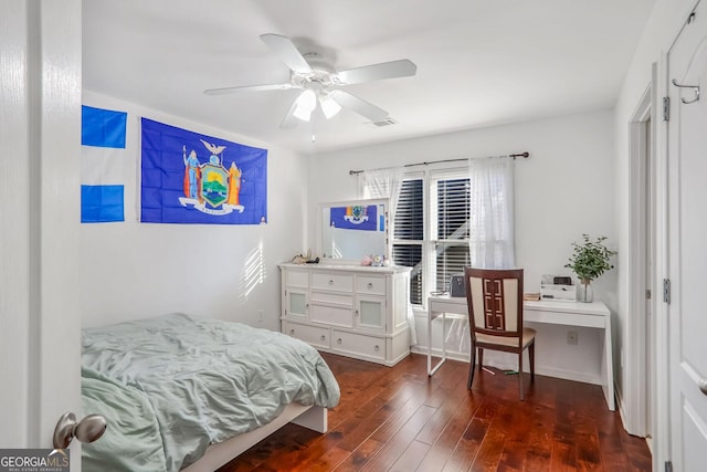 bedroom with ceiling fan and dark hardwood / wood-style flooring