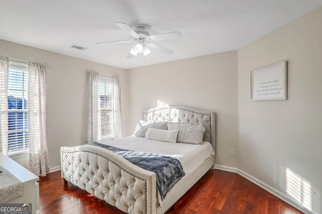 bedroom featuring ceiling fan and dark hardwood / wood-style floors