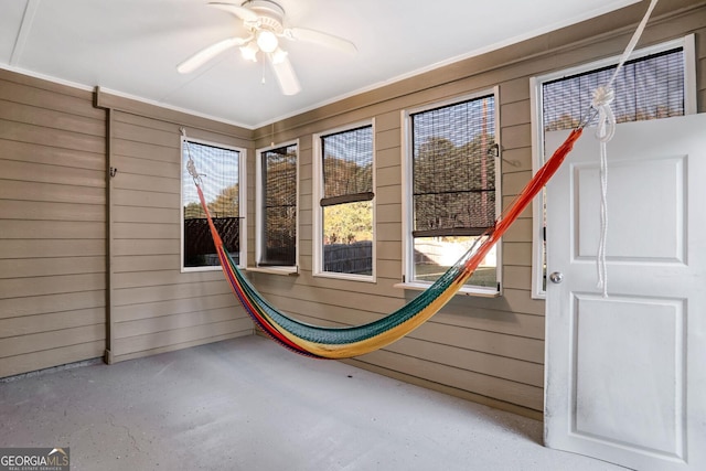 interior space featuring ceiling fan