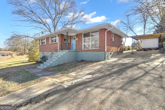 ranch-style home featuring a carport