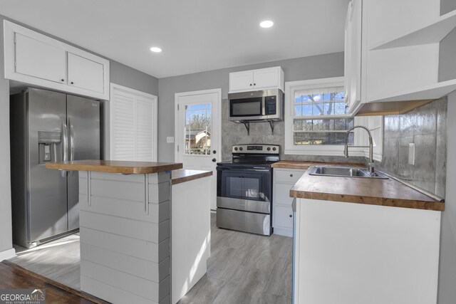 spare room featuring plenty of natural light and dark hardwood / wood-style floors