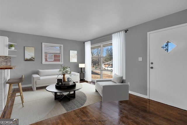 living room featuring dark wood-type flooring