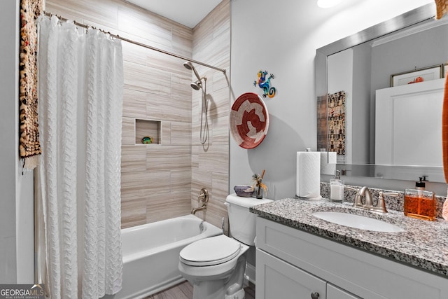 full bathroom featuring toilet, vanity, and shower / bath combo