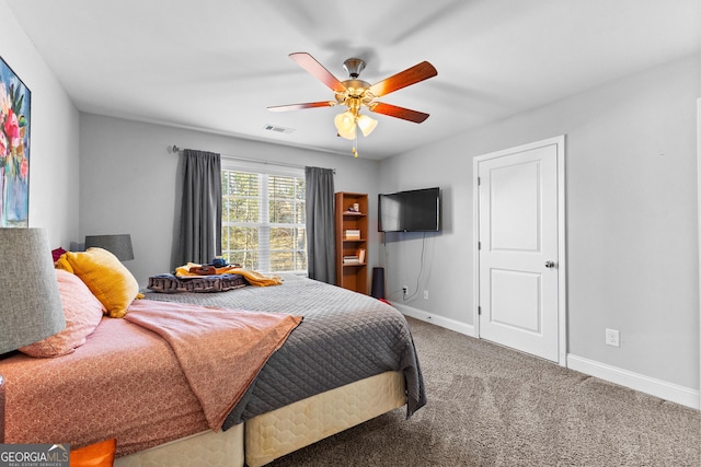 bedroom with ceiling fan and carpet