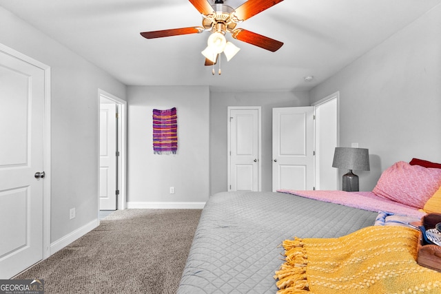 bedroom with ceiling fan and carpet floors