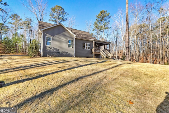 rear view of property with a lawn