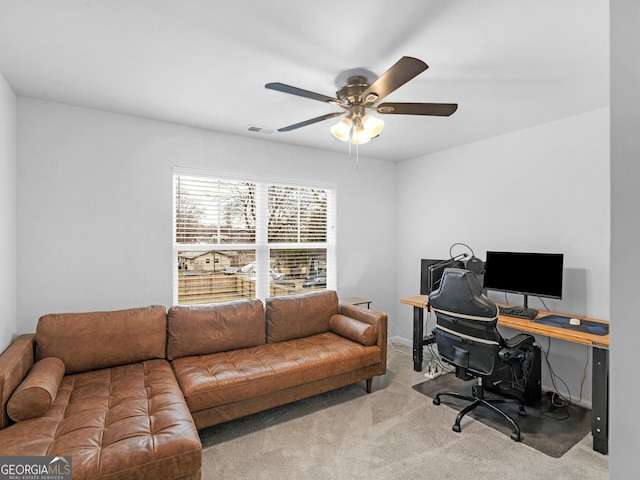 carpeted office with ceiling fan