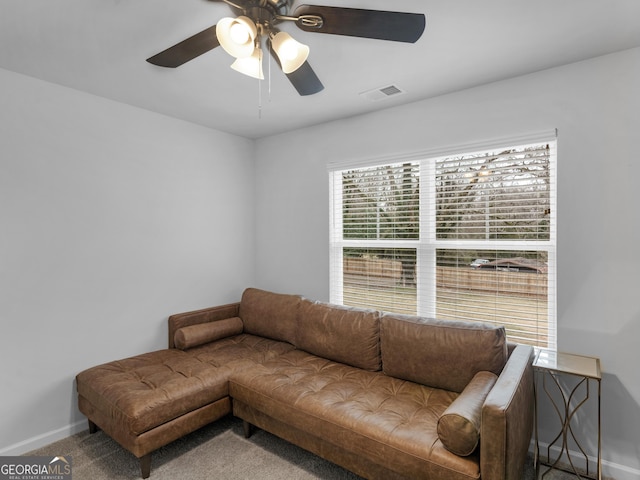 living room with carpet flooring and ceiling fan