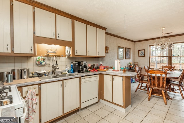 kitchen featuring kitchen peninsula, hanging light fixtures, sink, white appliances, and white cabinets