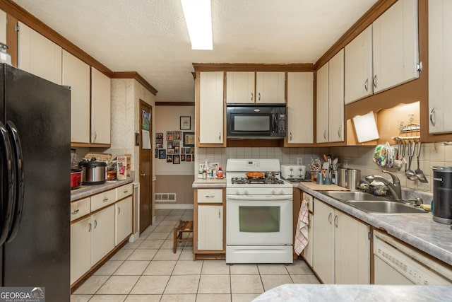 kitchen with light tile patterned floors, sink, black appliances, ornamental molding, and decorative backsplash