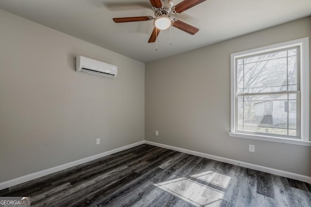 unfurnished room featuring dark wood-style floors, plenty of natural light, baseboards, and a wall unit AC