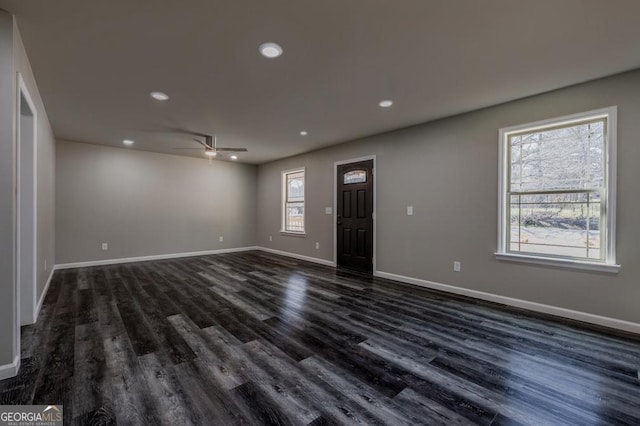 interior space featuring recessed lighting, baseboards, dark wood-style flooring, and a ceiling fan