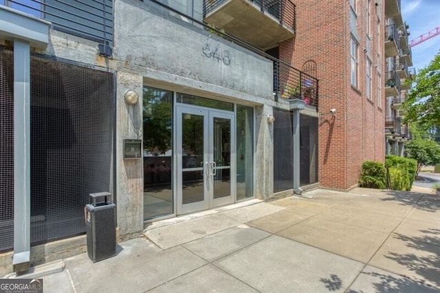 entrance to property featuring french doors