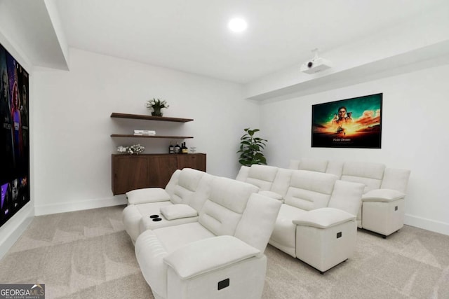 living area with recessed lighting, light colored carpet, and baseboards