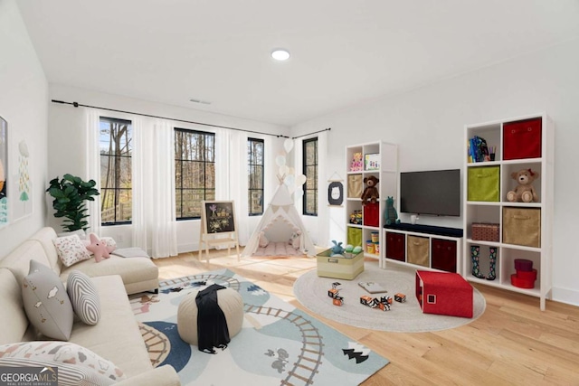 living room featuring recessed lighting and wood finished floors