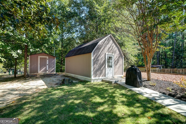 view of outbuilding featuring a yard