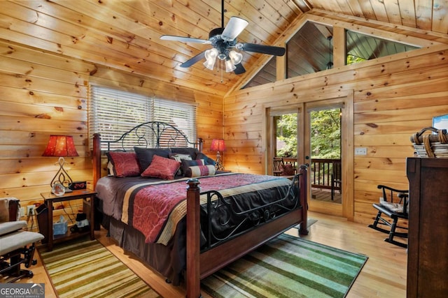 bedroom with access to outside, light hardwood / wood-style flooring, ceiling fan, and wooden ceiling