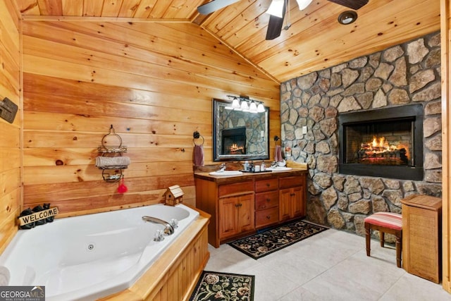 bathroom featuring a stone fireplace, wooden ceiling, tile patterned floors, vaulted ceiling, and a washtub