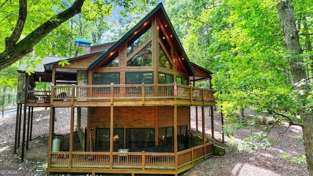 rear view of house with a sunroom