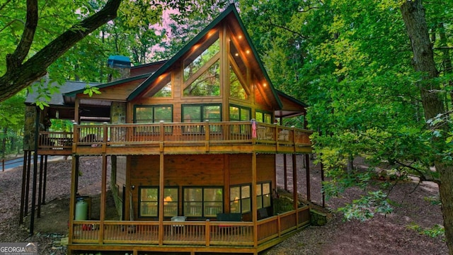 rear view of house with a deck