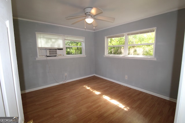 spare room featuring wood-type flooring, ceiling fan, crown molding, and cooling unit