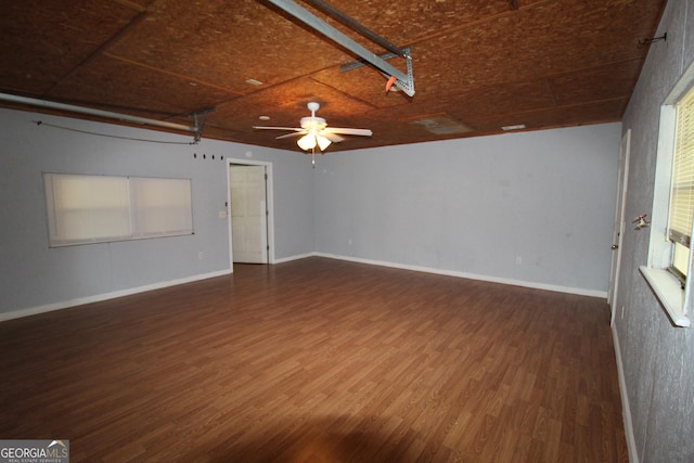 spare room featuring ceiling fan and dark hardwood / wood-style floors