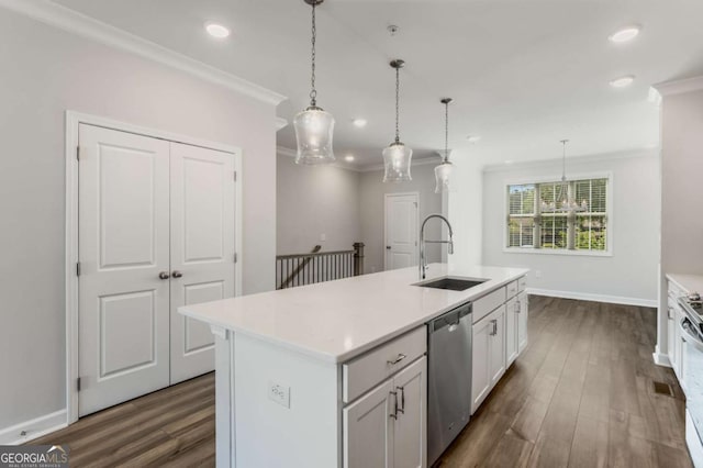 1708 Evenstad Way, Smyrna, GA 30080 - kitchen with stainless steel dishwasher, ornamental molding, dark wood finished floors, light countertops, and recessed lighting