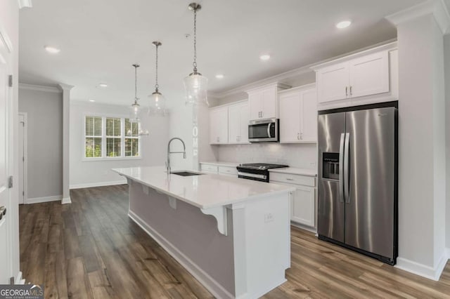 1708 Evenstad Way, Smyrna, GA 30080 - kitchen with stainless steel appliances, a kitchen island with sink, white cabinets, decorative backsplash, and ornamental molding