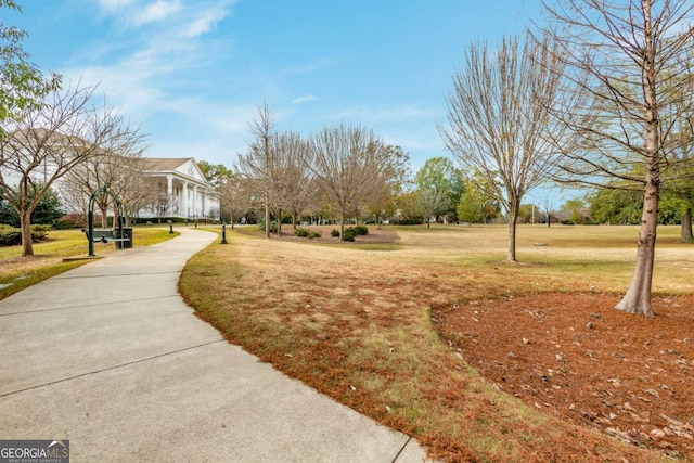 view of home's community featuring a yard