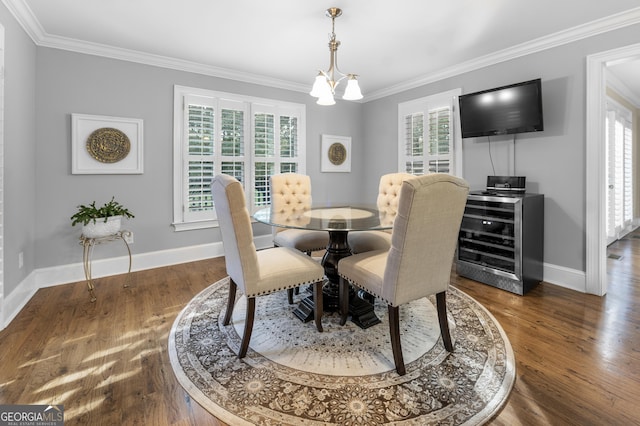 dining space featuring dark wood-type flooring, an inviting chandelier, wine cooler, and crown molding