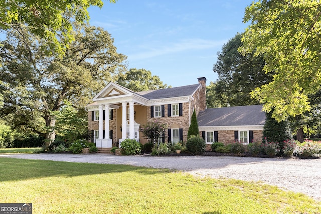 neoclassical / greek revival house with a front yard