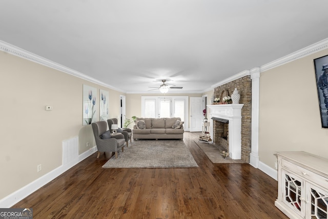 living room with ceiling fan, dark hardwood / wood-style flooring, and ornamental molding