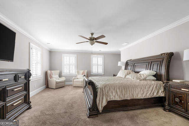 carpeted bedroom with ceiling fan and ornamental molding