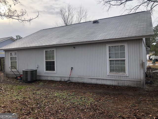 view of side of property featuring central air condition unit