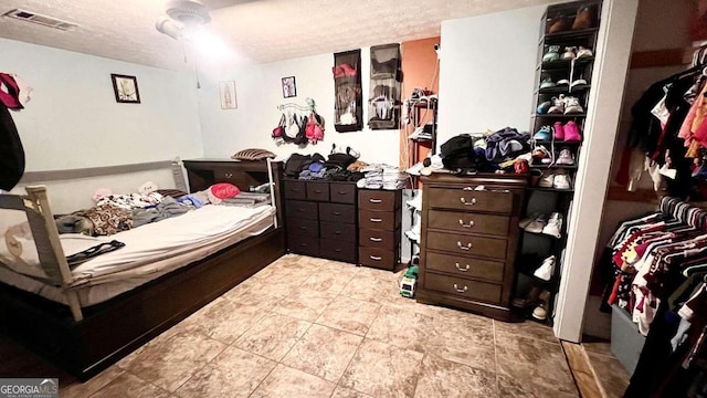 bedroom featuring a textured ceiling