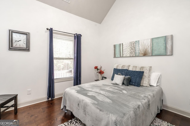 bedroom with dark wood-type flooring and vaulted ceiling