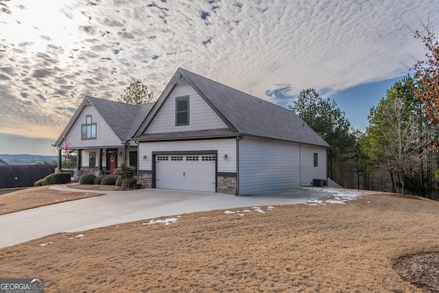 view of front of property featuring central air condition unit and covered porch