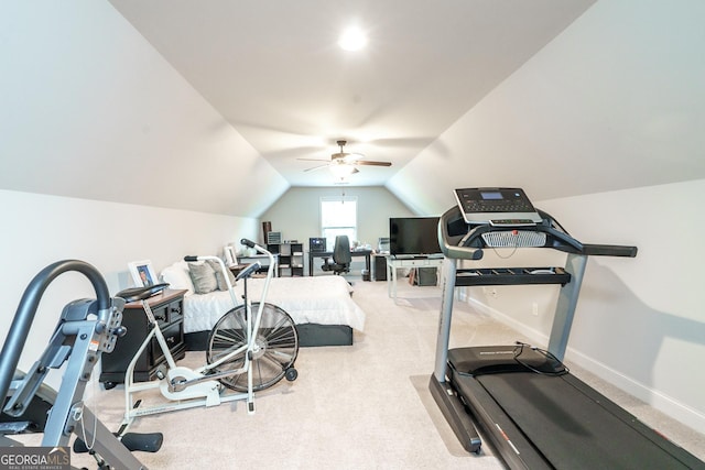 exercise area featuring lofted ceiling, carpet floors, and ceiling fan