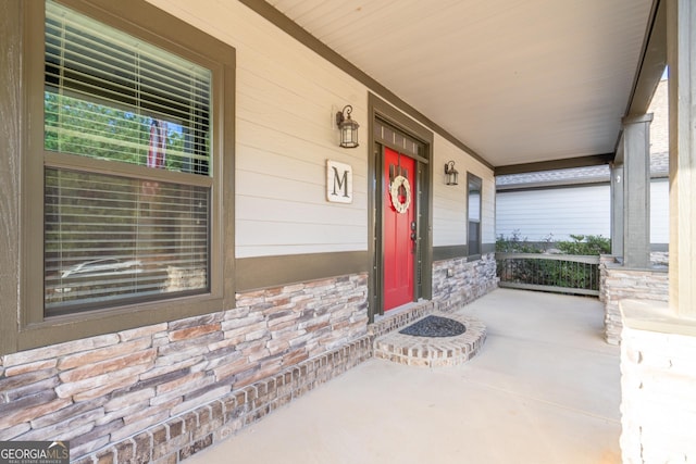 doorway to property with a porch